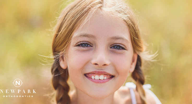 girl smiling with crooked teeth
