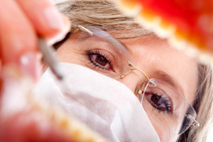 Female dentist working on a patients teeth